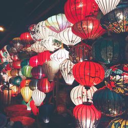 Low angle view of illuminated lanterns hanging on ceiling
