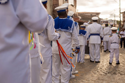 Members of a chegança group are seen parading in the streets of the city of saubara, in bahia.