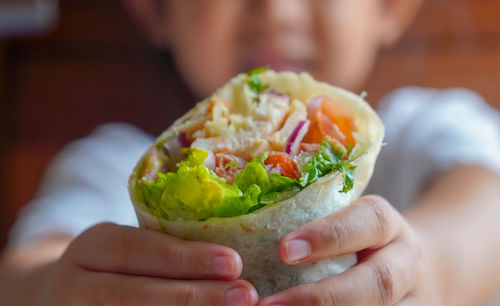 Close-up of person holding food