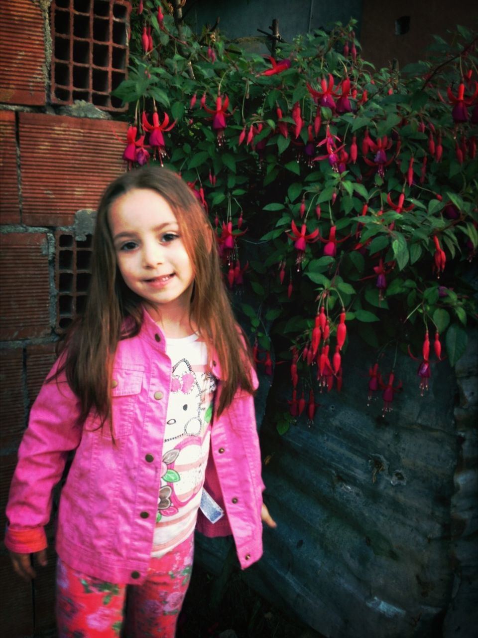 person, lifestyles, casual clothing, young women, standing, red, leisure activity, long hair, looking at camera, pink color, front view, young adult, flower, portrait, smiling, girls, three quarter length