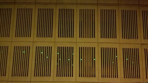 Close-up of illuminated modern building at night