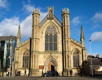 Facade of historic building against sky