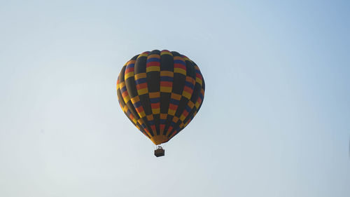 Low angle view of hot air balloon against clear sky