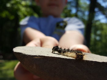 Close-up of young man sitting outdoors