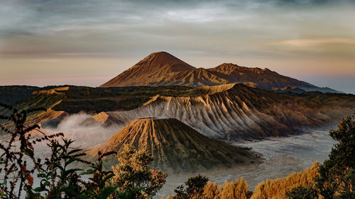 Panoramic view of mountain range against sky during sunset