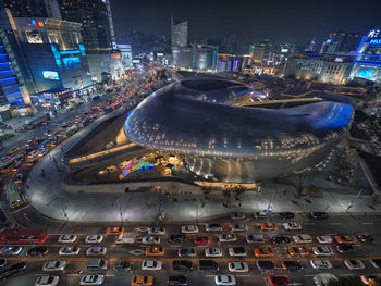 High angle view of illuminated city buildings at night