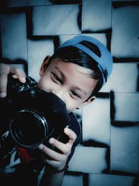 Portrait of boy photographing