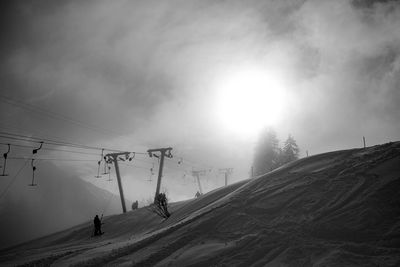 Overhead cable car against sky during winter