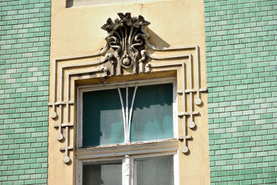 Low angle view of statue against building