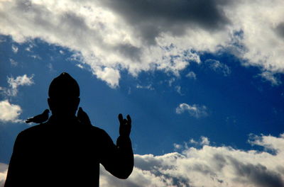 Low angle view of statue against cloudy sky