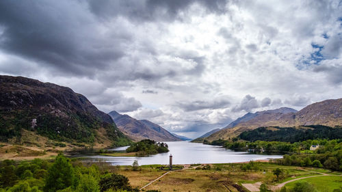 Scenic view of lake by mountains against sky in scotland