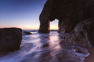 Scenic view of sea against clear sky during sunset