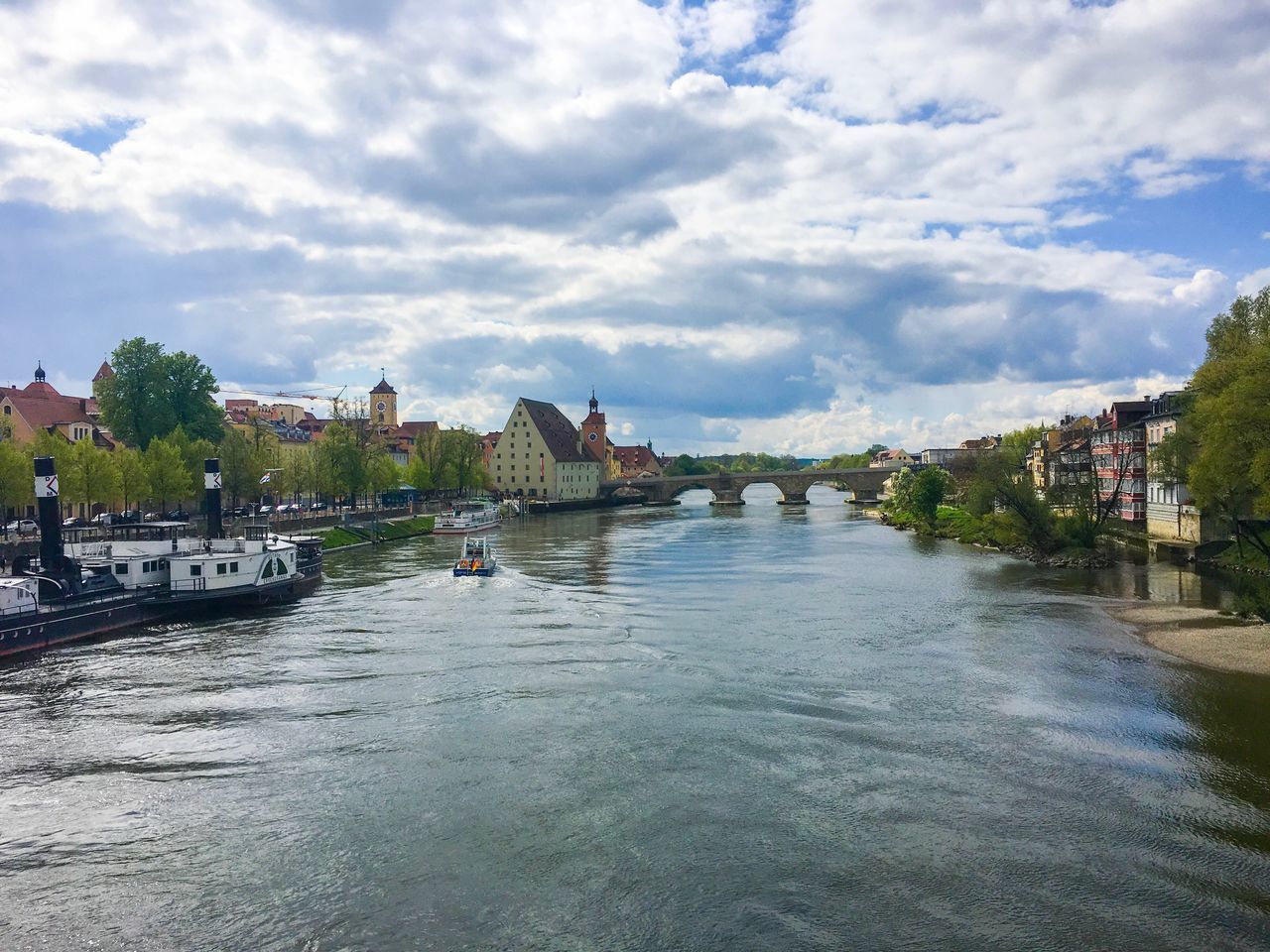 architecture, sky, water, built structure, cloud - sky, river, nautical vessel, transportation, waterfront, building exterior, day, mode of transport, outdoors, nature, city, no people, tree, cityscape