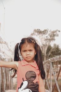 Portrait of cute girl standing outdoors