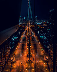 Illuminated city street at night