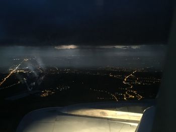 Aerial view of illuminated cityscape at night