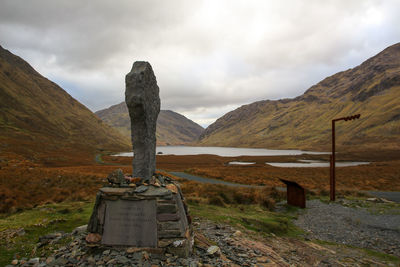 Built structure on rock against sky