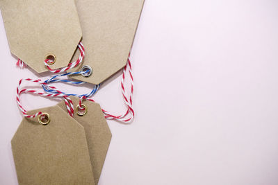 High angle view of eyeglasses on paper against white background