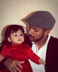 Close-up father and daughter against wall