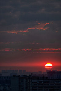Silhouette buildings against sky during sunset