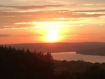 Scenic view of silhouette mountains against sky during sunset