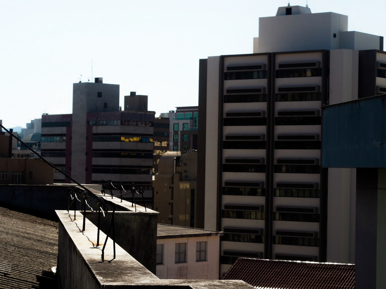 built structure, architecture, building exterior, sky, no people, building, city, nature, clear sky, outdoors, day, connection, business, transportation, modern, water, office building exterior, technology, sunlight, office, apartment