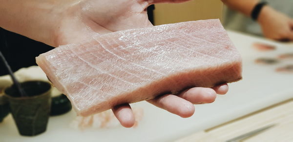 Close-up of hand holding ice cream