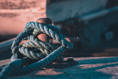 Close-up of rope tied up on metal