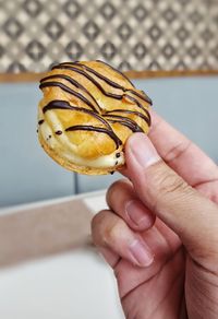 Close-up of hand holding ice cream