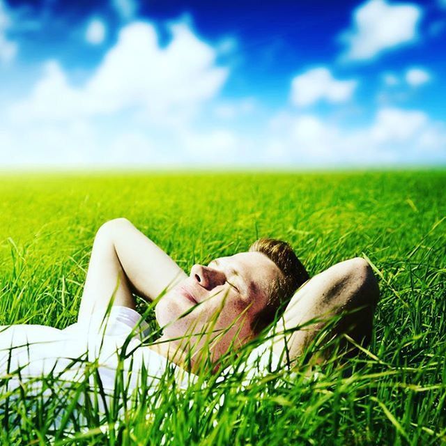 grass, field, grassy, relaxation, green color, lying down, lifestyles, leisure activity, sitting, resting, relaxing, landscape, low section, grassland, sky, person, day