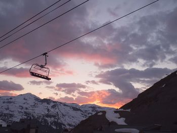 Scenic view of mountains against cloudy sky