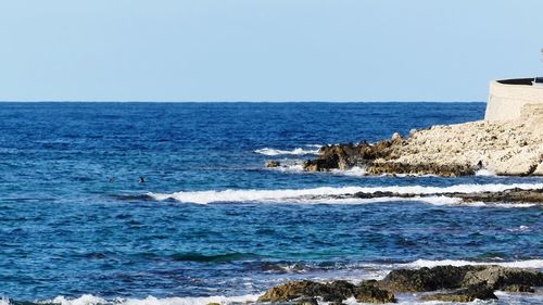 Scenic view of sea against clear sky