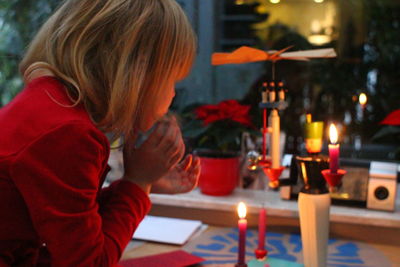 Close-up of boy playing birthday candles