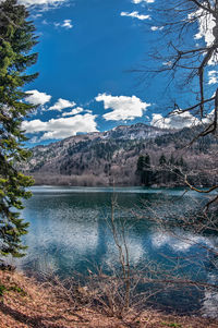 Scenic view of lake and mountains against sky