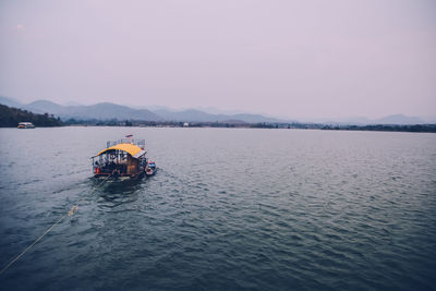 High angle view of boat on lake against sky during sunset