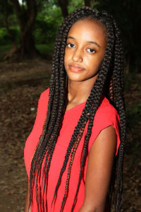 Portrait of young woman with braided hair style