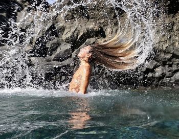 Woman swimming in sea