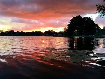 Scenic view of lake against sky during sunset