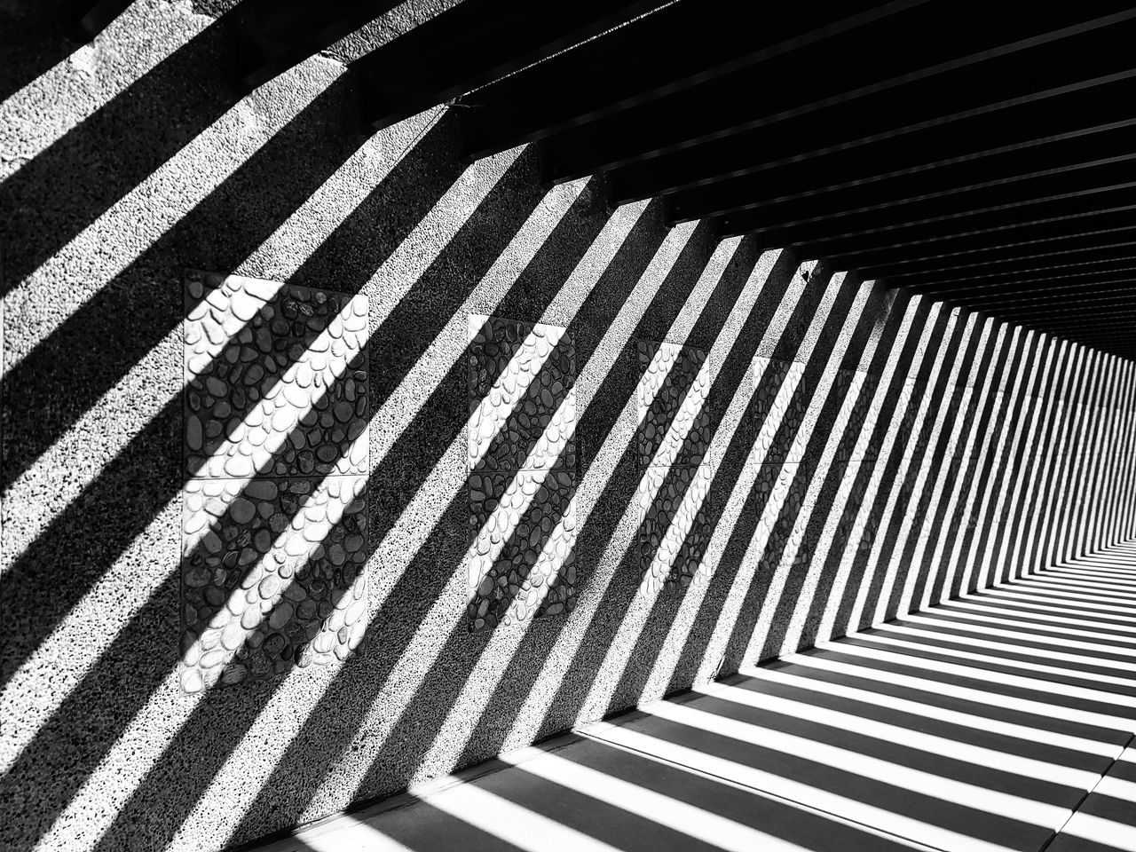 pattern, striped, black and white, line, black, monochrome, monochrome photography, no people, white, architecture, crosswalk, road marking, shadow, repetition, day, sunlight, city, zebra crossing, high angle view, transportation, built structure, road, staircase, full frame, backgrounds, crossing, indoors, symbol, marking, close-up