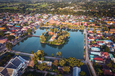 High angle view of buildings and trees in city