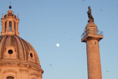 Low angle view of building against clear blue sky