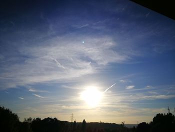 Low angle view of silhouette trees against sky during sunset