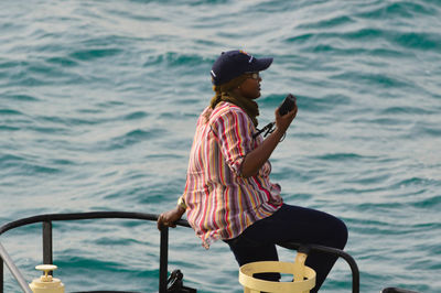 Man sitting in sea