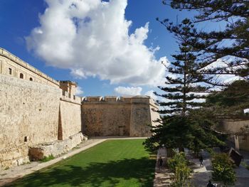 View of historic building against cloudy sky