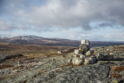 Rock formation on land against sky