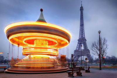 Ferris wheel in city against sky