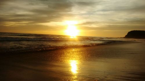 Scenic view of sea at sunset