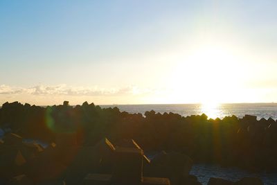 Panoramic view of people against sky during sunset