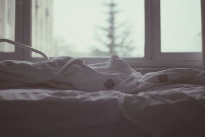 Close-up of blanket on bed at home