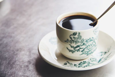 Close-up of coffee cup on table